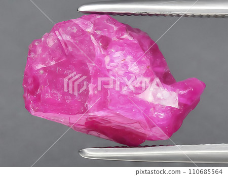 natural red ruby rough gem on the background natural red ruby rough gem on the background 110685564