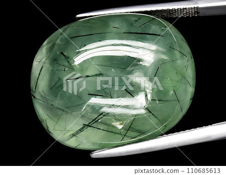 natural green prehnite gem on the background 110685613