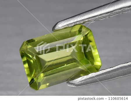 natural green peridote olivine gem on the background 110685614