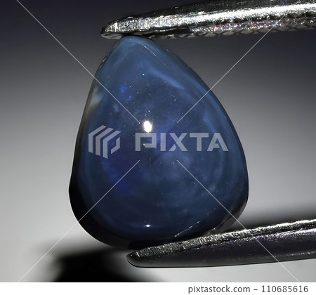 natural rainbow multi color opal gem on the background natural rainbow multi color opal gem on the background 110685616