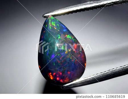 natural rainbow multi color opal gem on the background 110685619
