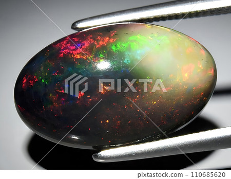 natural rainbow multi color opal gem on the background 110685620