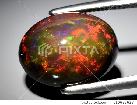 natural rainbow multi color opal gem on the background natural rainbow multi color opal gem on the background 110685628