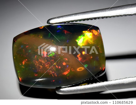 natural rainbow multi color opal gem on the background natural rainbow multi color opal gem on the background 110685629