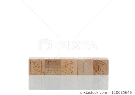 Wooden cubes with letters music on a white background 110685646