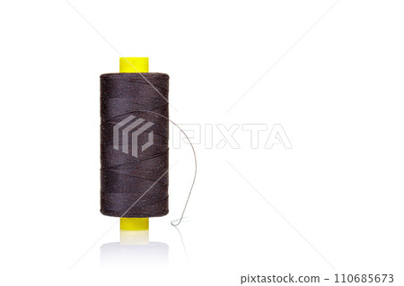skein of thread brown colors macro on a white background 110685673