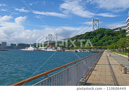 Kanmon Bridge with people walking along the Mekari Observation Promenade in Moji Ward, Kitakyushu City Kanmon Bridge with people walking along the Mekari Observation Promenade in Moji Ward, Kitakyushu City 110686449