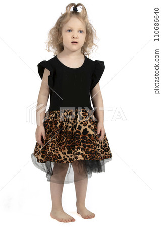 Little blonde girl on a white background. Barefoot child. Little blonde girl on a white background. Barefoot child. 110686640