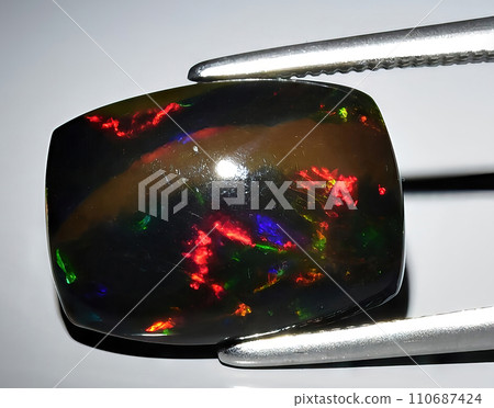natural rainbow multi color opal gem on the background natural rainbow multi color opal gem on the background 110687424