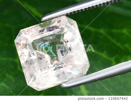 natural pink morganite beryl gem on the background 110687442