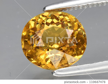 natural yellow grossular gem on the background natural yellow grossular gem on the background 110687478