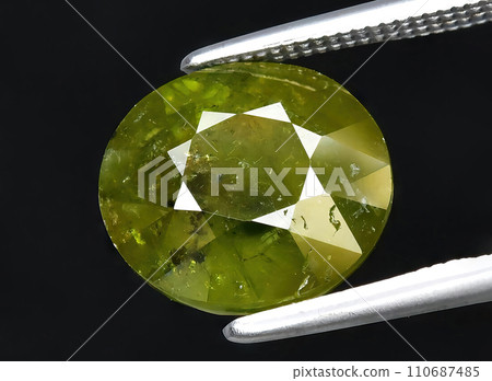 natural green garnet grossular gem on the background 110687485