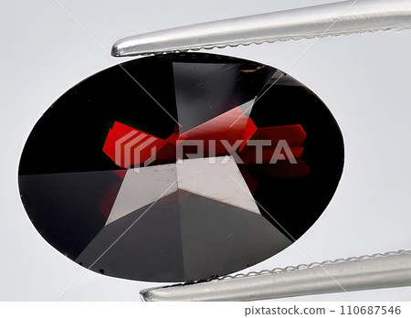 natural red almandine garnet on the background 110687546