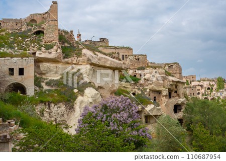 Rock sandstone wall of an ancient house of Cappadocia. Beautiful texture of the wall of an ancient cave dwelling. 110687954
