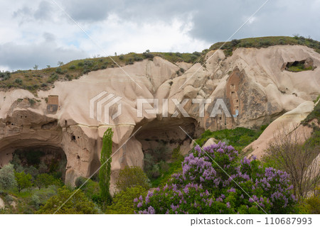 Rock sandstone wall of an ancient house of Cappadocia. Beautiful texture of the wall of an ancient cave dwelling. Rock sandstone wall of an ancient house of Cappadocia. Beautiful texture of the wall of an ancient cave dwelling. 110687993