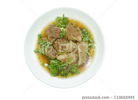 braised beef meat stew topping slice parsley and spring onion on plate dipping chili sauce  110688995
