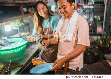 asian male seller plating fried egg asian male seller plating fried egg 110689150
