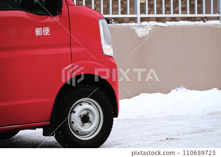 red postman car in winter red postman car in winter 110689723