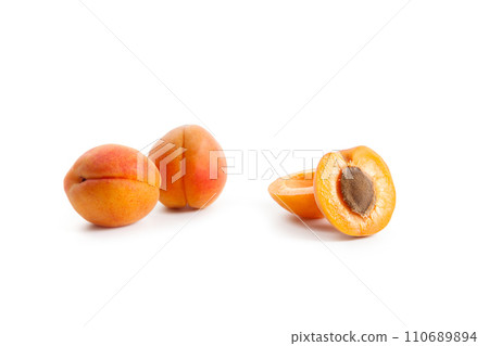 Apricot fruit whole and half isolated on white background.. 110689894
