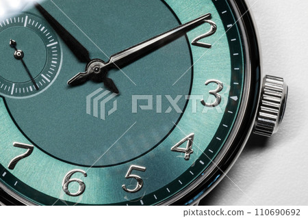 Gents wrist watch with green clock, macro photo 110690692