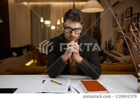 Portrait of serious focused business man looking at camera webcam view Portrait of serious focused business man looking at camera webcam view 110691379