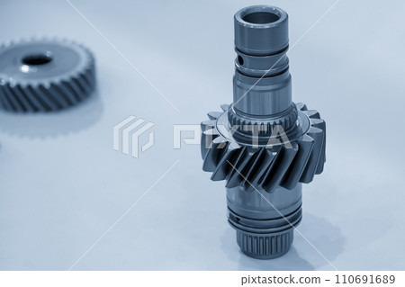 Close-up scene of transmission  gear spare parts in the light blue scene. 110691689