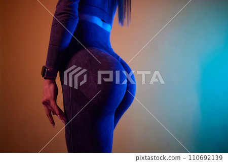 Close-up of a woman doing deadlift exercise alone at the gym. Close-up of a woman doing deadlift exercise alone at the gym. 110692139