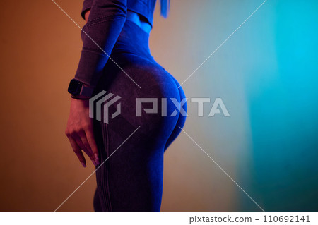 Close-up of a woman doing deadlift exercise alone at the gym. Close-up of a woman doing deadlift exercise alone at the gym. 110692141