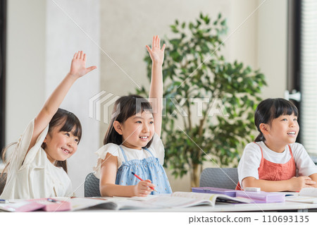 Elementary school students studying at a cram school. Elementary school students studying at a cram school. 110693135