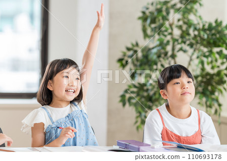 Elementary school students studying at a cram school. Elementary school students studying at a cram school. 110693178