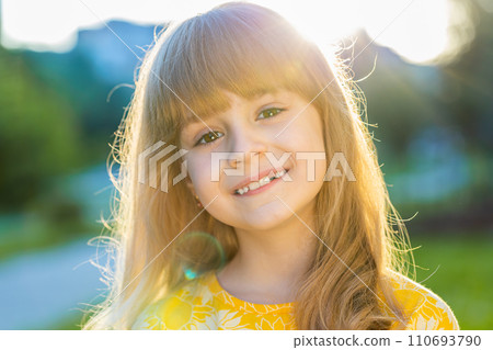 Portrait of happy preteen child girl face smiling looking at camera good mood, satisfied on park Portrait of happy preteen child girl face smiling looking at camera good mood, satisfied on park 110693790