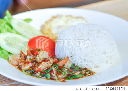 stir fried shrimp with holy basil and sunny side up egg or fried egg stir fried shrimp with holy basil and sunny side up egg or fried egg 110694154