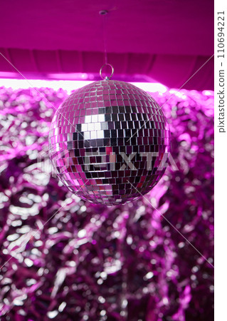Disco ball with bright rays, night party background photo Disco ball with bright rays, night party background photo 110694221