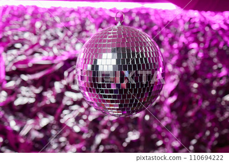Disco ball with bright rays, night party background photo Disco ball with bright rays, night party background photo 110694222