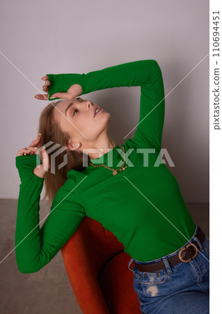 High fashion photo of a beautiful elegant young woman in a pretty beige suit 110694451