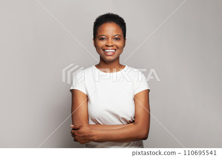 Confident happy woman smiling and having fun against white studio wall background 110695541