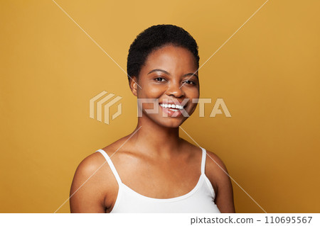 Cute happy woman smiling and having fun against white studio wall background 110695567