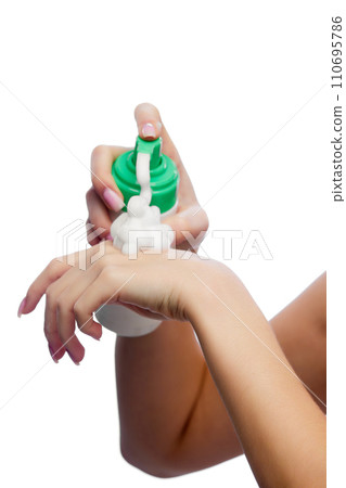 Cropped portrait of young woman using foamy facial care cosmetic product against white background. 110695786