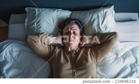 AI-generated content. Woman Resting Comfortably With Her Head on Her Hands in Bed 110696158