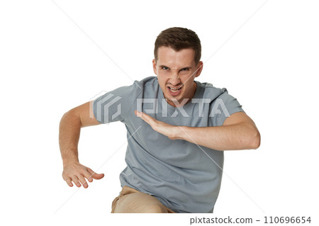 annoyed angry man fighting on white studio background 110696654