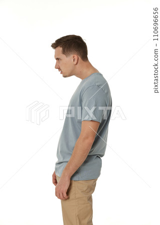 annoyed angry man standing on white studio background 110696656