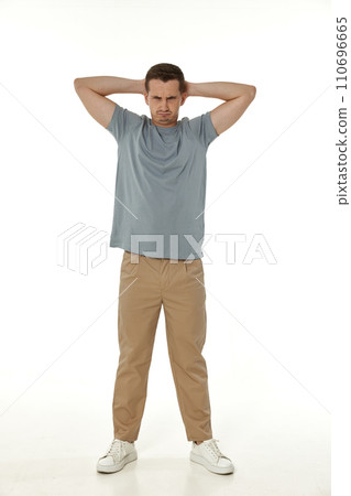offended frustrated young man on white background. sadness 110696665