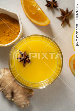 Immune boosting drink. Ginger, orange fruit and turmeric shot drink, healthy beverage. 110697017