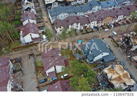 Hostomel, Kyev region Ukraine - 09.04.2022: Top view of the destroyed and burnt houses. Houses were destroyed by rockets or mines from Russian soldiers. Cities of Ukraine after the Russian occupation. Hostomel, Kyev region Ukraine - 09.04.2022: Top view of the destroyed and burnt houses. Houses were destroyed by rockets or mines from Russian soldiers. Cities of Ukraine after the Russian occupation. 110697926