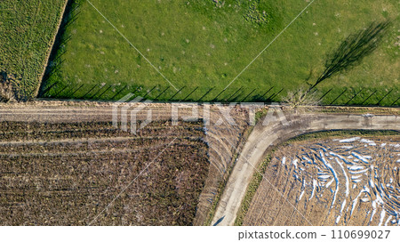 Seasonal Patchwork: Aerial View of Agricultural Fields 110699027