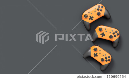 Realistic orange video game joysticks or gamepads on black background 110699264