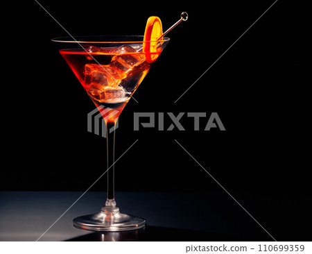Refreshing Bourbon Manhattan cocktail with vermouth and maraschino cherry garnish isolated on black background/ 110699359