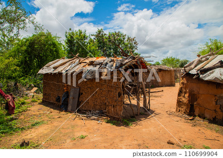 Kenya. Little girl in national dress from the Maasai village 110699904