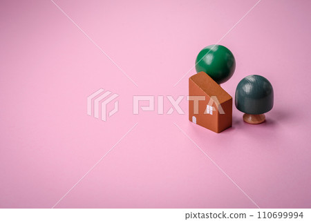 A small wooden house and keys as an idea for investing in your own home and achieving the goal of buying real estate A small wooden house and keys as an idea for investing in your own home and achieving the goal of buying real estate 110699994