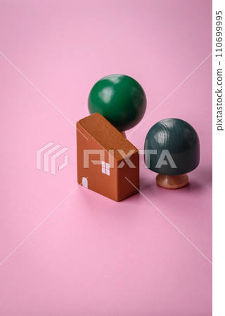 A small wooden house and keys as an idea for investing in your own home and achieving the goal of buying real estate A small wooden house and keys as an idea for investing in your own home and achieving the goal of buying real estate 110699995